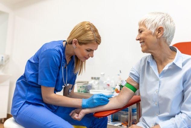 GP preparing an iron infusion for a patient at Harbour Town Doctors, a bulk billing clinic in Biggera Waters on the Gold Coast
